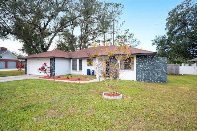 ranch-style house with a garage and a front yard