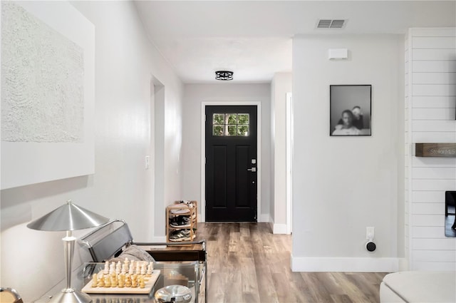 foyer entrance with light hardwood / wood-style floors