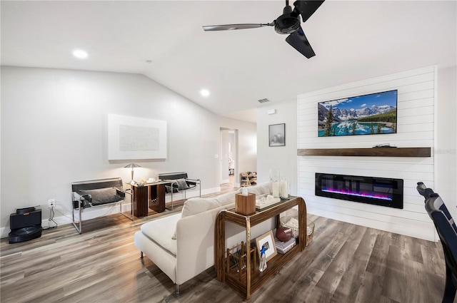 living room with wood-type flooring, lofted ceiling, and ceiling fan