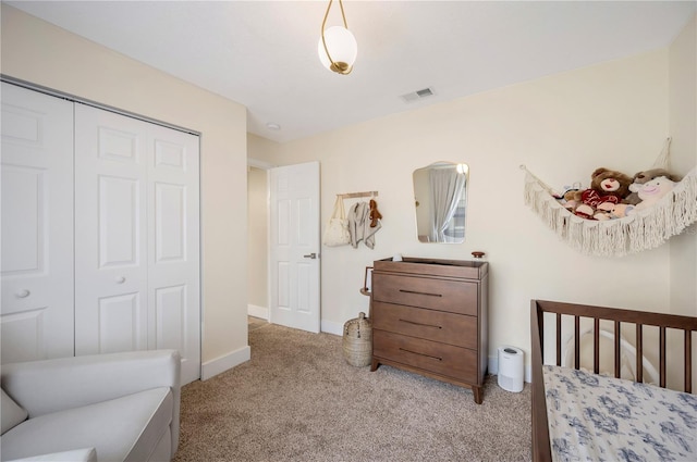 carpeted bedroom with a closet