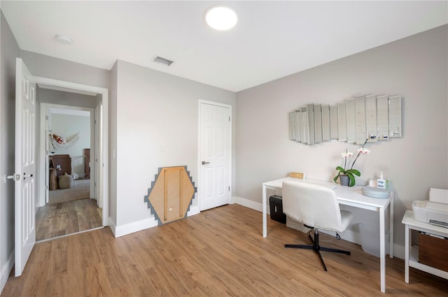 office area featuring light hardwood / wood-style floors