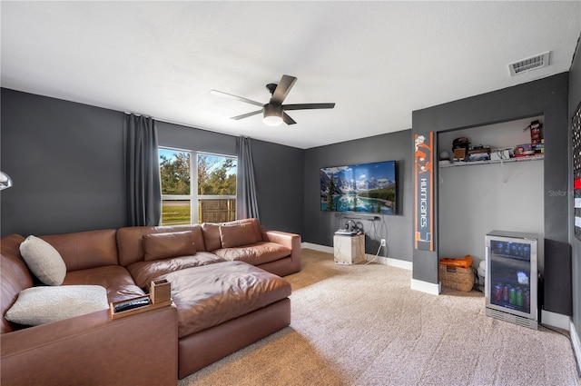 living room featuring carpet floors, wine cooler, and ceiling fan