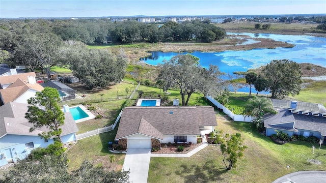 birds eye view of property featuring a water view