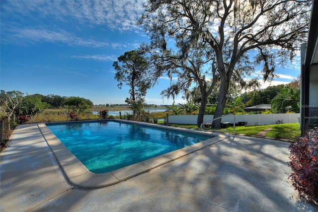 view of swimming pool featuring a patio area