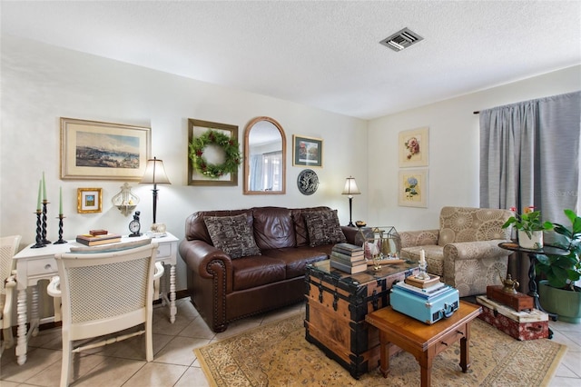 tiled living room with a textured ceiling