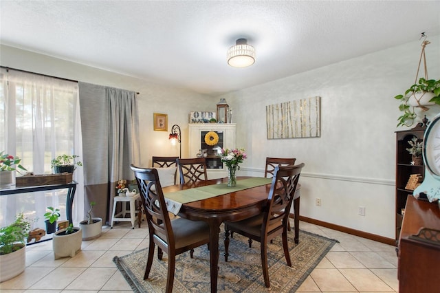 dining space featuring light tile patterned floors