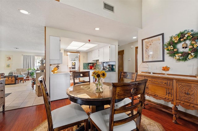 dining area featuring light wood-type flooring