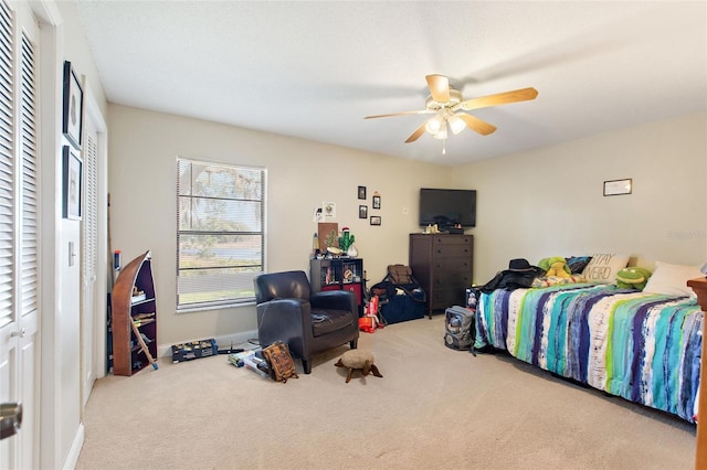 carpeted bedroom with ceiling fan