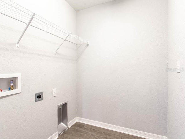 clothes washing area featuring hookup for a washing machine, dark wood-type flooring, and hookup for an electric dryer