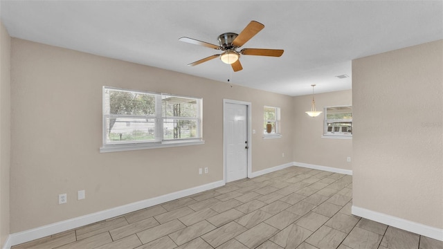 entryway featuring ceiling fan