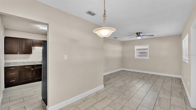 spare room featuring ceiling fan