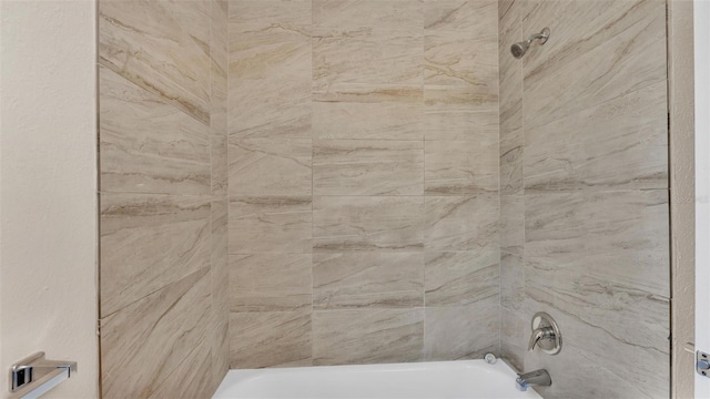 details featuring tiled shower / bath