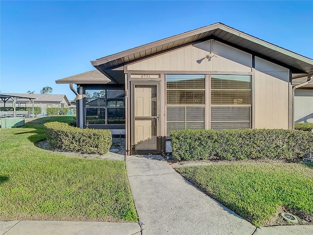 4531 Blossom Blvd Unit 4531, Zephyrhills, FL 33542 - view of exterior entry with a lawn