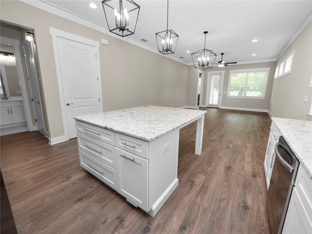 kitchen with white cabinetry, a center island, ceiling fan, hanging light fixtures, and stainless steel dishwasher