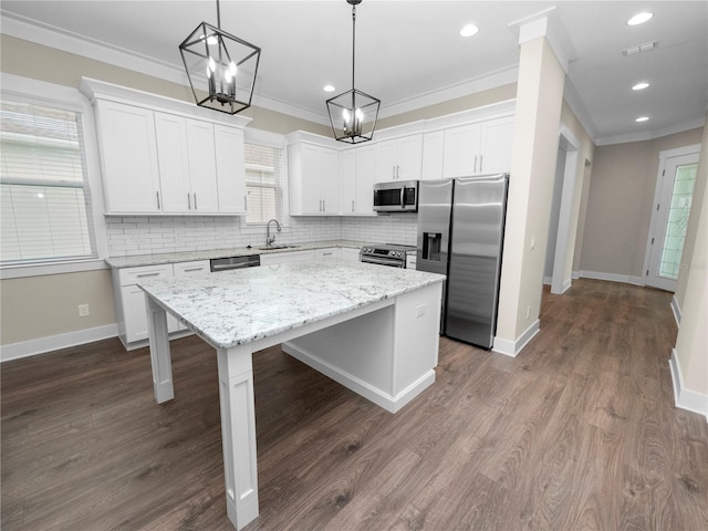 kitchen featuring white cabinetry, a center island, and appliances with stainless steel finishes