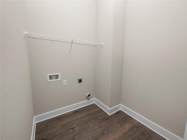 laundry area featuring electric dryer hookup, hookup for a washing machine, and dark hardwood / wood-style floors