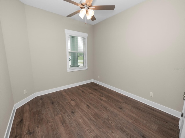 empty room featuring ceiling fan and dark hardwood / wood-style flooring