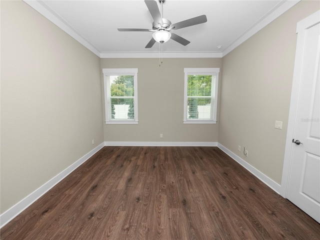 spare room with crown molding, dark wood-type flooring, ceiling fan, and a healthy amount of sunlight