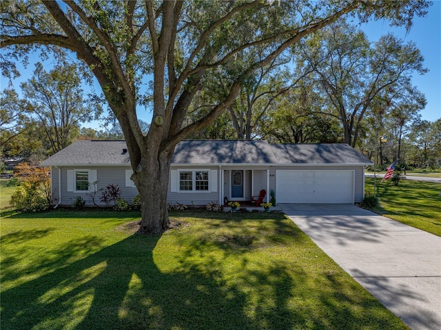 single story home with a garage and a front yard