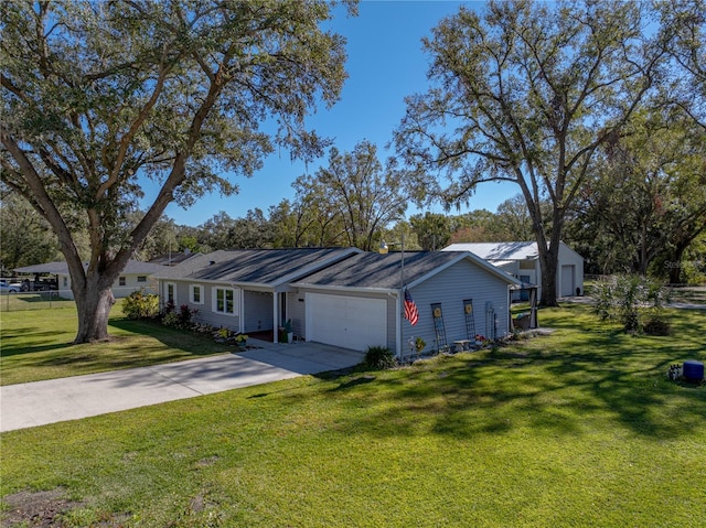 ranch-style home featuring a front yard and a garage