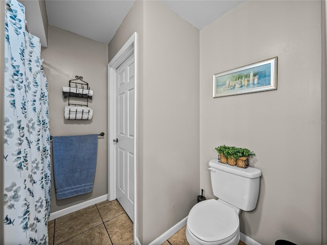 bathroom with tile patterned floors and toilet