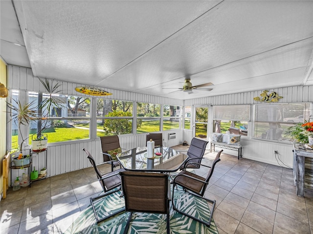 sunroom featuring ceiling fan