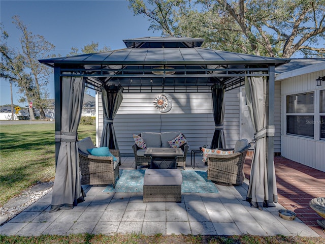 view of patio featuring a gazebo, a deck, and an outdoor hangout area