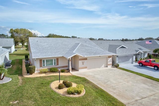 ranch-style home with a front yard and a garage