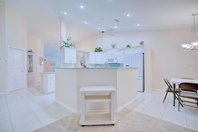 kitchen featuring white appliances, white cabinetry, hanging light fixtures, and light tile patterned flooring