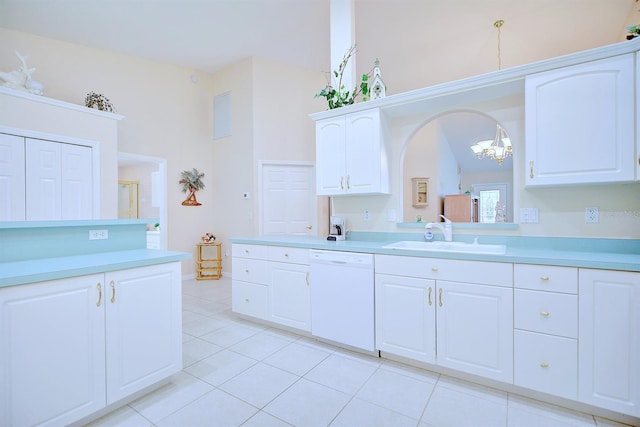 kitchen with sink, white cabinets, white dishwasher, pendant lighting, and light tile patterned flooring