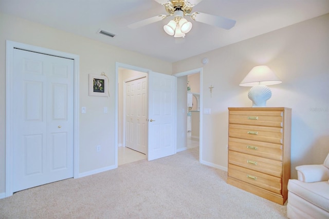 unfurnished room with ceiling fan and light carpet