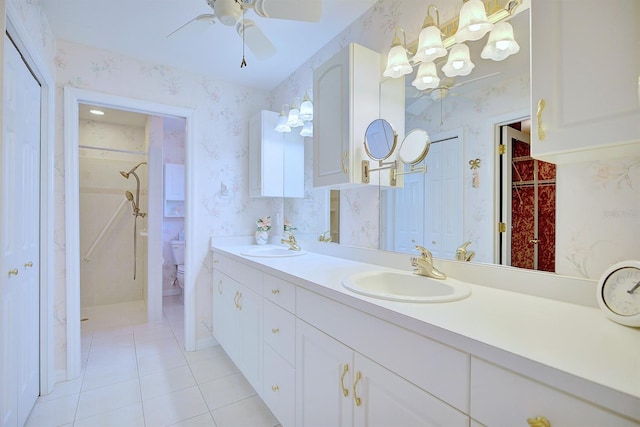 bathroom featuring vanity, tile patterned floors, ceiling fan, toilet, and walk in shower