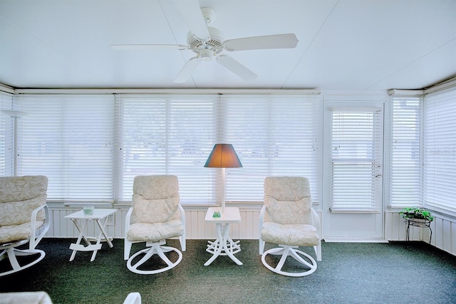 sunroom / solarium featuring ceiling fan