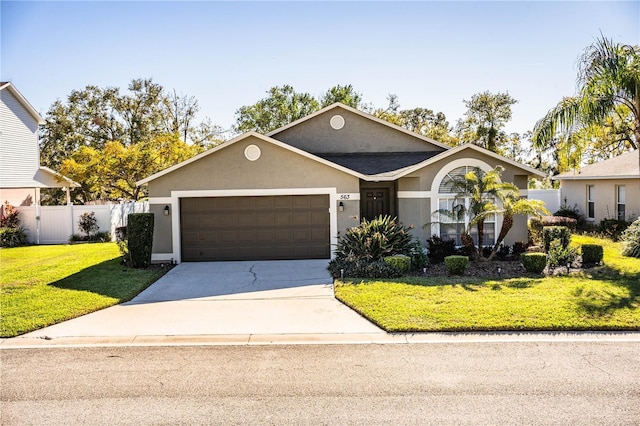 view of front facade featuring a garage and a front yard