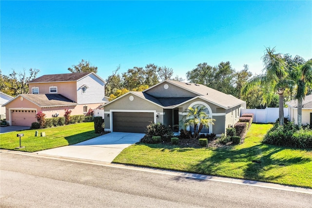 view of front of home featuring a garage and a front yard