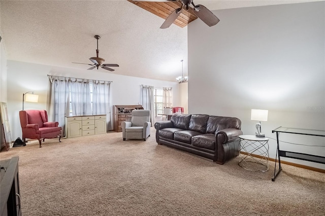 living room featuring carpet, lofted ceiling with beams, and ceiling fan with notable chandelier