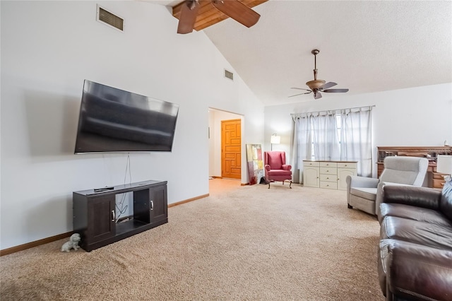 living room featuring beamed ceiling, ceiling fan, carpet flooring, and high vaulted ceiling