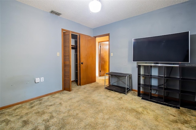 interior space featuring a textured ceiling