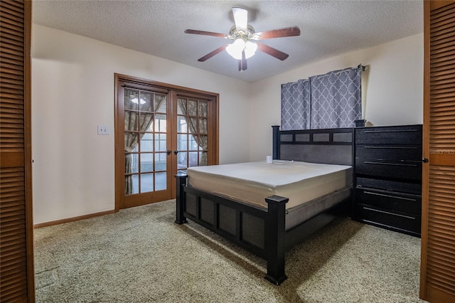 bedroom with carpet flooring, french doors, a textured ceiling, and ceiling fan