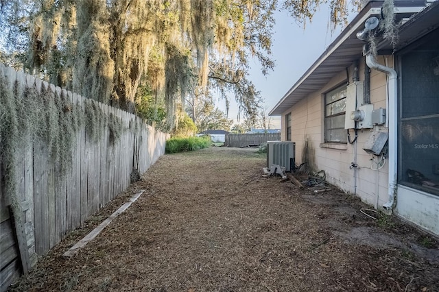 view of yard featuring central air condition unit