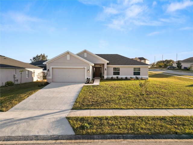 ranch-style house with a garage and a front lawn