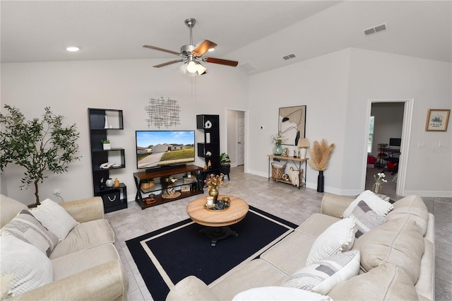 living room with vaulted ceiling, ceiling fan, and light tile patterned flooring