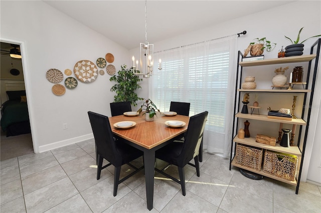 dining area with an inviting chandelier and light tile patterned flooring