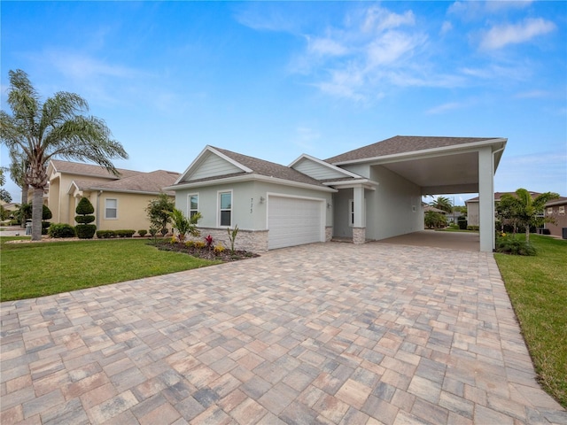 view of front of home with a garage, a front lawn, and a carport