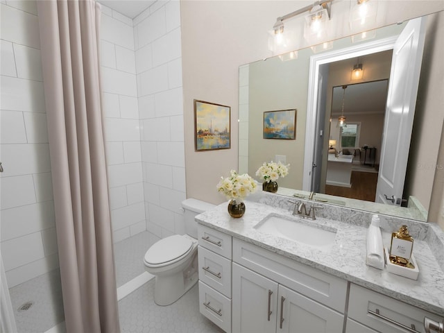 bathroom with toilet, vanity, tile patterned floors, and a shower with shower curtain