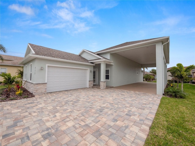 view of front of house with a garage and a carport