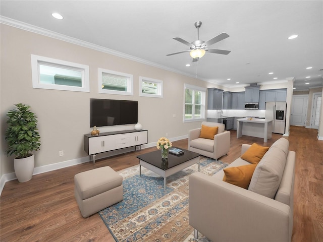 living room featuring ceiling fan, dark hardwood / wood-style floors, and ornamental molding