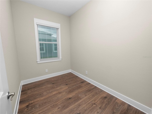 spare room featuring dark hardwood / wood-style flooring