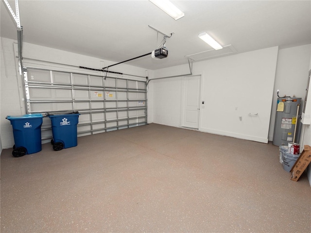 garage featuring electric water heater and a garage door opener