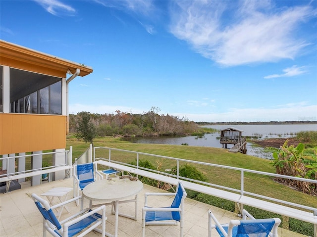 view of patio with a water view